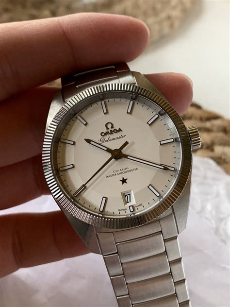 omega constellation globemaster white dial.